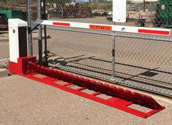DOMINATOR™ Motorized Surface Mount Traffic Wedge Barrier System 